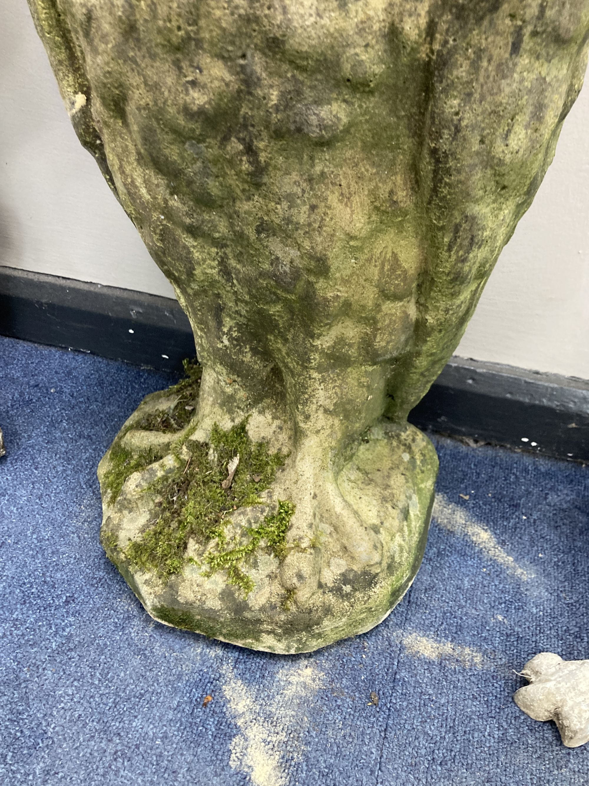 A reconstituted stone garden ornament modelled as an owl, height 70cm